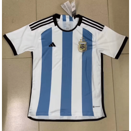 CAMISETA ARGENTINA PRIMERA EQUIPACIÓN Mundial Qatar 2022 Niño 3 Estrellas